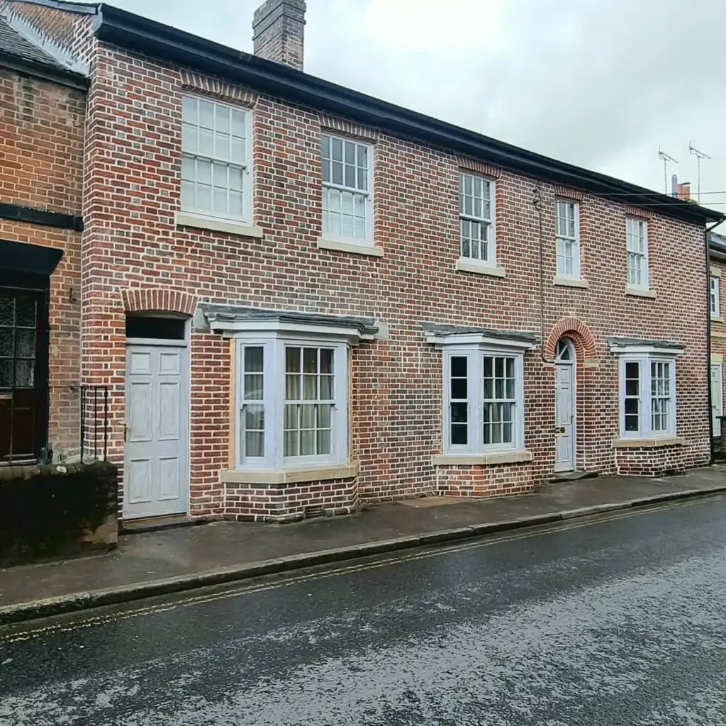 Brick terraced house repointed in lime mortar with replacement bricks