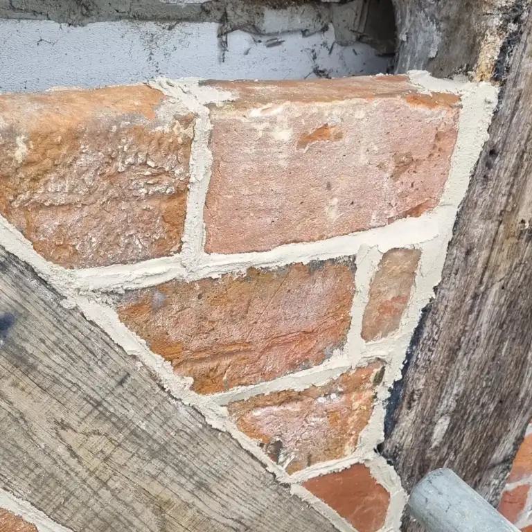 Timber-framed gable rebuilt with a new oak frame and brick infill, Inkpen