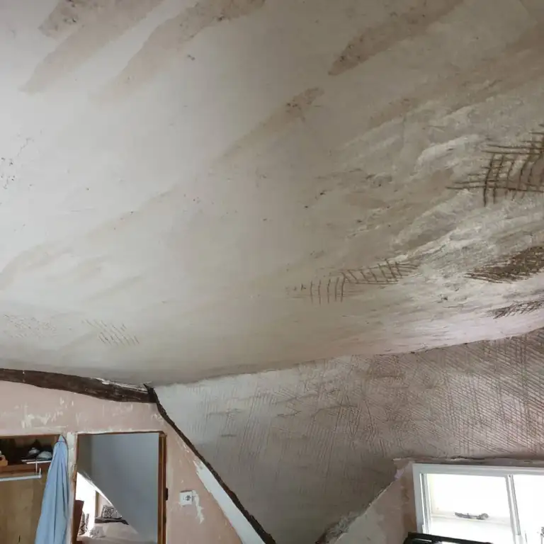 Lime plaster applied to new timber laths on walls and ceilings