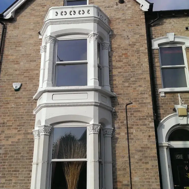 Victorian bay-fronted brick house repointed in lime mortar