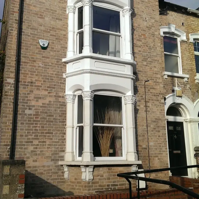 Victorian bay-fronted brick house repointed in lime mortar